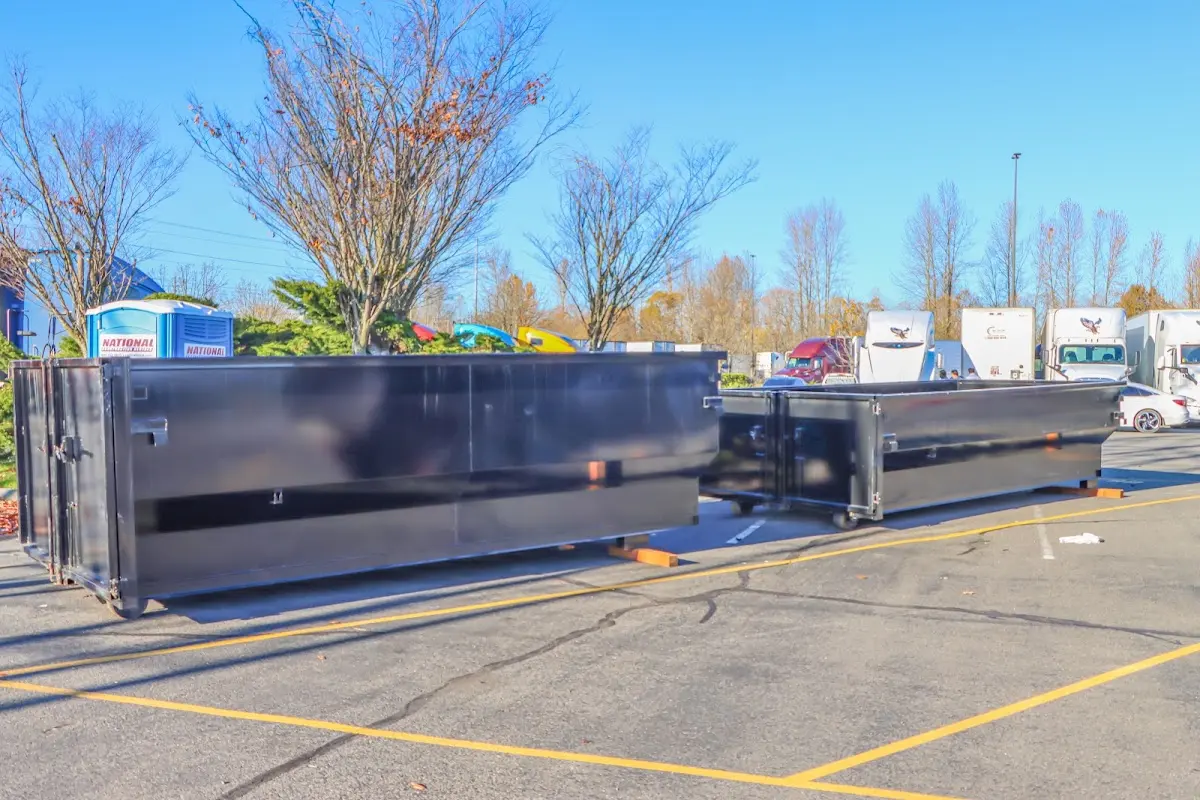 Professional dumpster rental service with roll-off container on residential driveway in Trophy Club